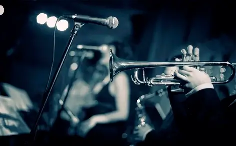 A jazz musician playing a passionate trumpet solo.
